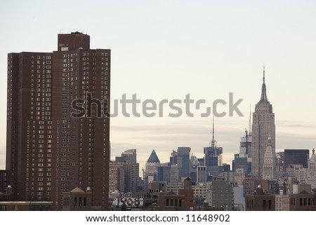 Juxtaposition of a Manhattan housing project with the Empire State Building
