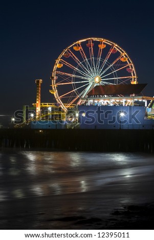 Vertical image of the Pacific Wheel, recently sold at auction, at the Santa Monica Pier amusement park.