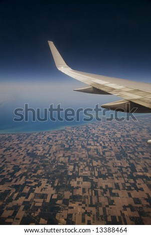Vertical view outside a jet plane window.