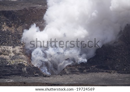 Horizontal image of the smoking caldera of the Kilauea volcano on Hawai\'i (Big Island), a shield volcano.