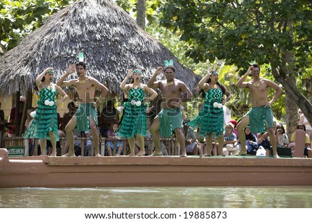 POLYNESIAN CULTURAL CENTER, OAHU, HI - JULY 26:  Students from New Zealand perform traditional Maori a tradtional Haka on a canoe.  Taken at the Rainbows of Paradise Canoe Pageant in 2008.