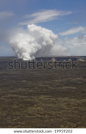 Vertical image of the smoking caldera of the Kilauea volcano on Hawaii (Big Island), a shield volcano.