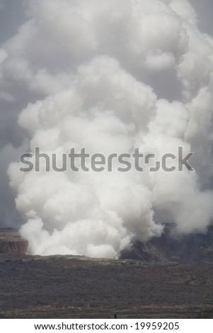 Vertical image of the smoking caldera of the Kilauea volcano on Hawaii (Big Island), a shield volcano.