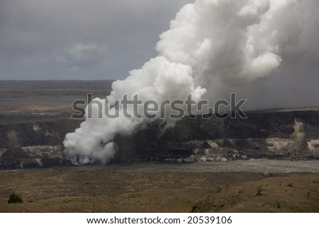 Horizontal image of the smoking caldera of the Kilauea volcano on Hawai\'i (Big Island), a shield volcano.