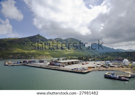 Horizontal image of a tug boat in Nawiliwili harbor in Kauai, HI.
