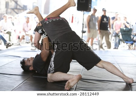 LOS ANGELES - APRIL 5:  Members of Torrance\'s IMB Academy show Mixed Martial Arts (MMA) at the Little Tokyo Cherry Blossom Festival on April 5th, 2009 in Los Angeles.