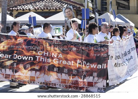 PASADENA, CA - JANUARY 18:  Protesters march against China\'s censorship of the internet at the Doo Dah Parade on January 18, 2009 in Pasadena.