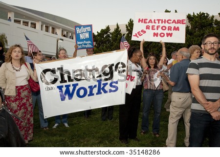 ALHAMBRA, CA - AUGUST 11: Supporters of health care reform hold up a banner in support of a health care rally held by U.S. Congressman Adam Schiff (D-CA) on August 11, 2009 in Alhambra.
