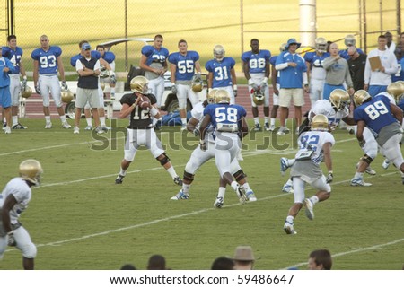 LOS ANGELES - AUGUST 21: UCLA Bruins scrimmage against each other on August 21, in Los Angeles. Quarterback Richard Brehaut passes the ball.