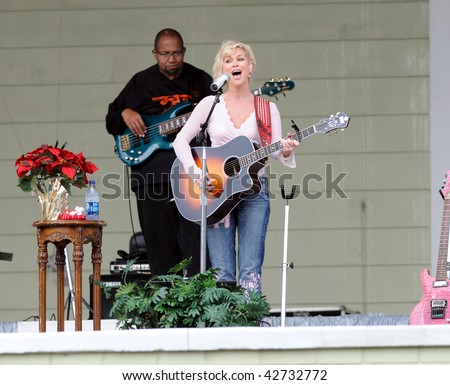 OCALA, FL - DECEMBER 12: Country music star Lorrie Morgan (right) playing live onstage at Silver Springs on December 12, 2009 in Ocala, Florida