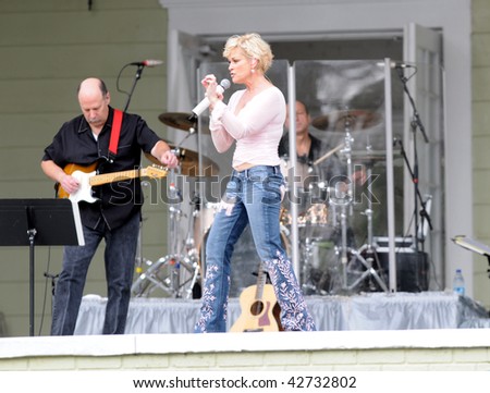 OCALA, FL - DECEMBER 12: Country music star Lorrie Morgan (center) playing live onstage at Silver Springs on December 12, 2009 in Ocala, Florida