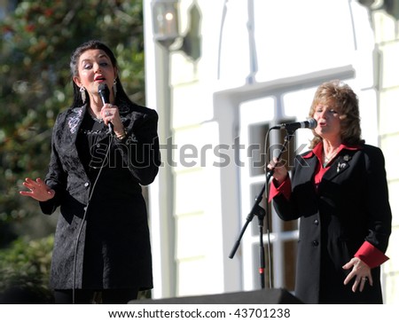 OCALA, FL - JANUARY 2: Country music star Crystal Gayle (left) with band members onstage at Silver Springs January 2, 2010 in Ocala, Florida.