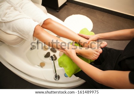 Feet massage during spa treatment Feet massage during spa treatment