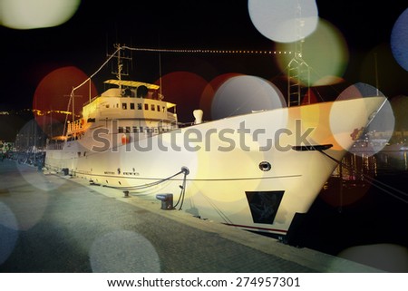 White boat at port, vintage bright dots.