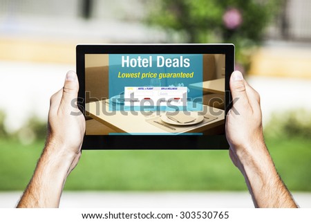 Hotel Deals on tablet. Web template design. Restaurant table setting in the background.