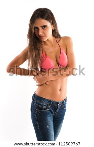 Beautiful slender Romanian brunette in a bikini top and jeans