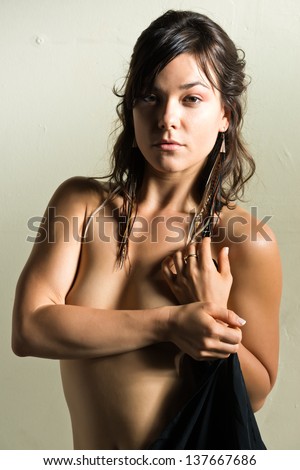 Petite athletic brunette posing nude
