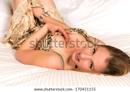Pretty young blonde woman in a print dress