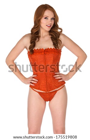 Petite freckled redhead in a orange corset