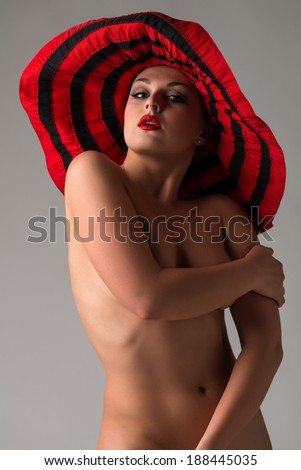 Nude Ukrainian woman in a red floppy hat
