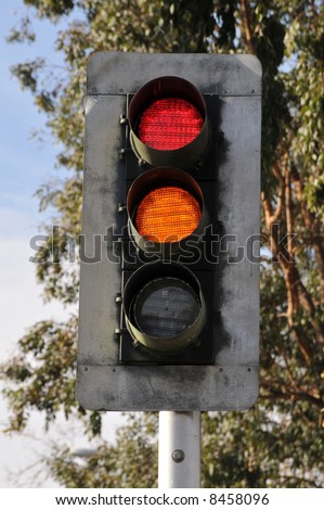 Traffic light on pole: red and yellow