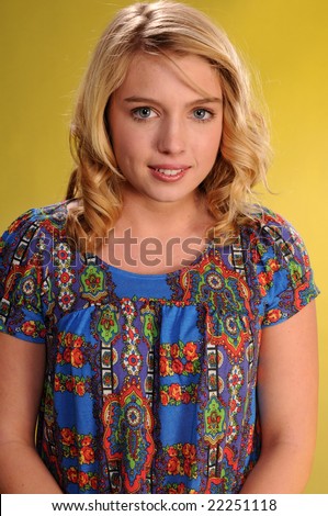 Pretty blonde teenager in a print blouse