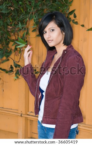 Pretty young Middle Eastern woman in a corduroy jacket