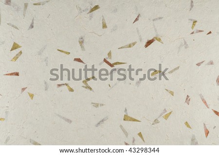 Handmade paper with bits of embedded metal foil