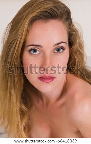 stock photo Pretty freckled young brunette nude in bed