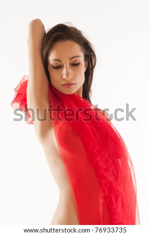 Pretty nude brunette wrapped in red cloth
