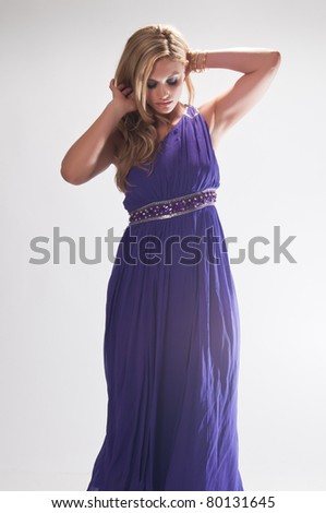 Beautiful tall blonde in the costume of a Greek goddess
