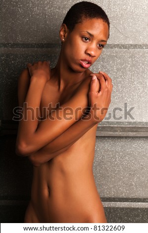 stock photo Slender young black woman posing nude