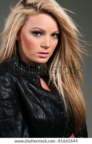 stock photo Beautiful curvy blonde in a black leather jacket