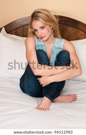 Pretty blonde woman in a powder blue blouse