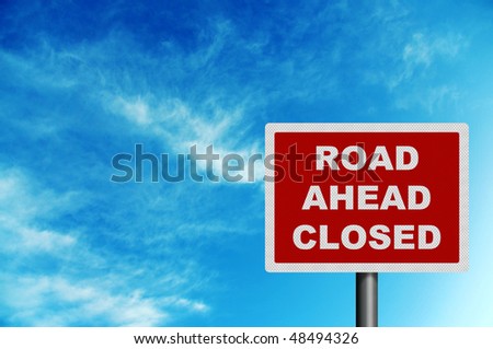 Photo realistic metallic reflective \'road closed ahead\' sign, against a bright blue sky