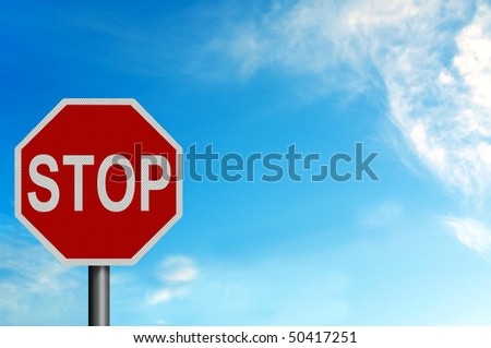 Photo realistic metallic reflective \'Stop\' sign, against a bright blue sunny summer sky. With space for your text / editorial overlay