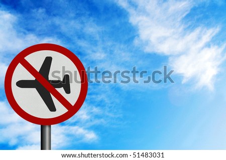 Photo realistic metallic reflective 'no flying' sign, against a bright blue sunny summer sky. With space for your text / editorial overlay