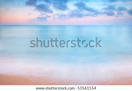 A peaceful scene of a calm ocean and sunset