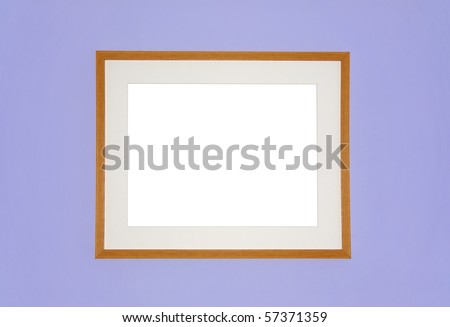 Photo of simple wooden frame and mount on a lilac wall, with blank white space for your editing
