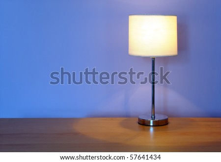 lamp on a wooden desk, with space for your text / editorial overlay