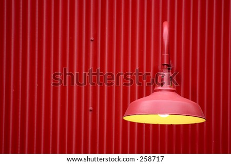 Red light against red metal background