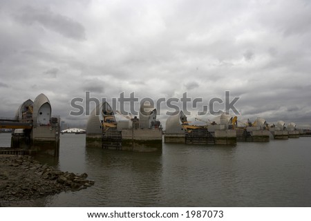 thames barrier the millennium dome can be seen in the gap between two of the gates woolwich docklands london city england