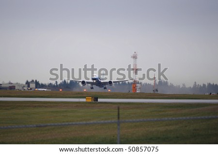 EVERETT, WA - DEC 15: Boeing 787 airplane on it\'s first flight on December 15, 2009 at Paine Field Everett Washington.