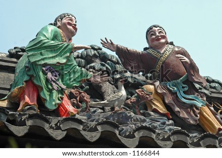 Two guys and a bird, on a temple roof, Shanghai.