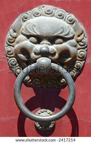Lion knocker on a temple door, Shanghai, China.