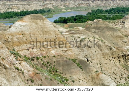 The Red Deer River flowing through the badlands of Dinosaur Provincial Park, Alberta - a UNESCO World Heritage Site.