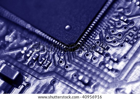 Closeup of the components on the motherboard of a disk drive.