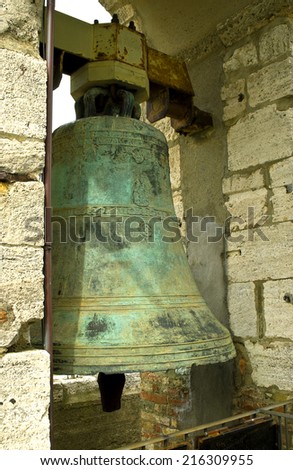 Ancient bronze bell on the tower in the town of Montepulciano, Italy