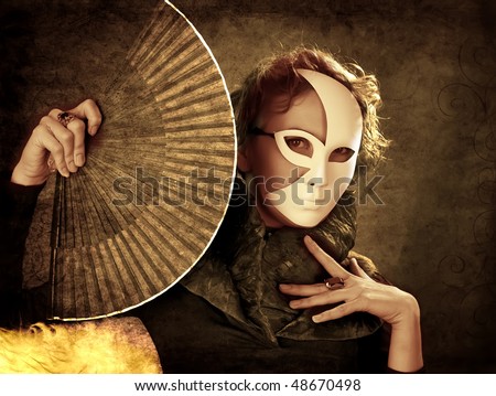Woman with a fan in carnival mask art work