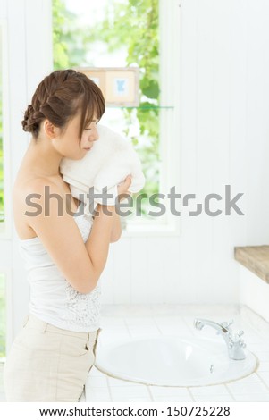 Beauty asian woman washing her face with clean water